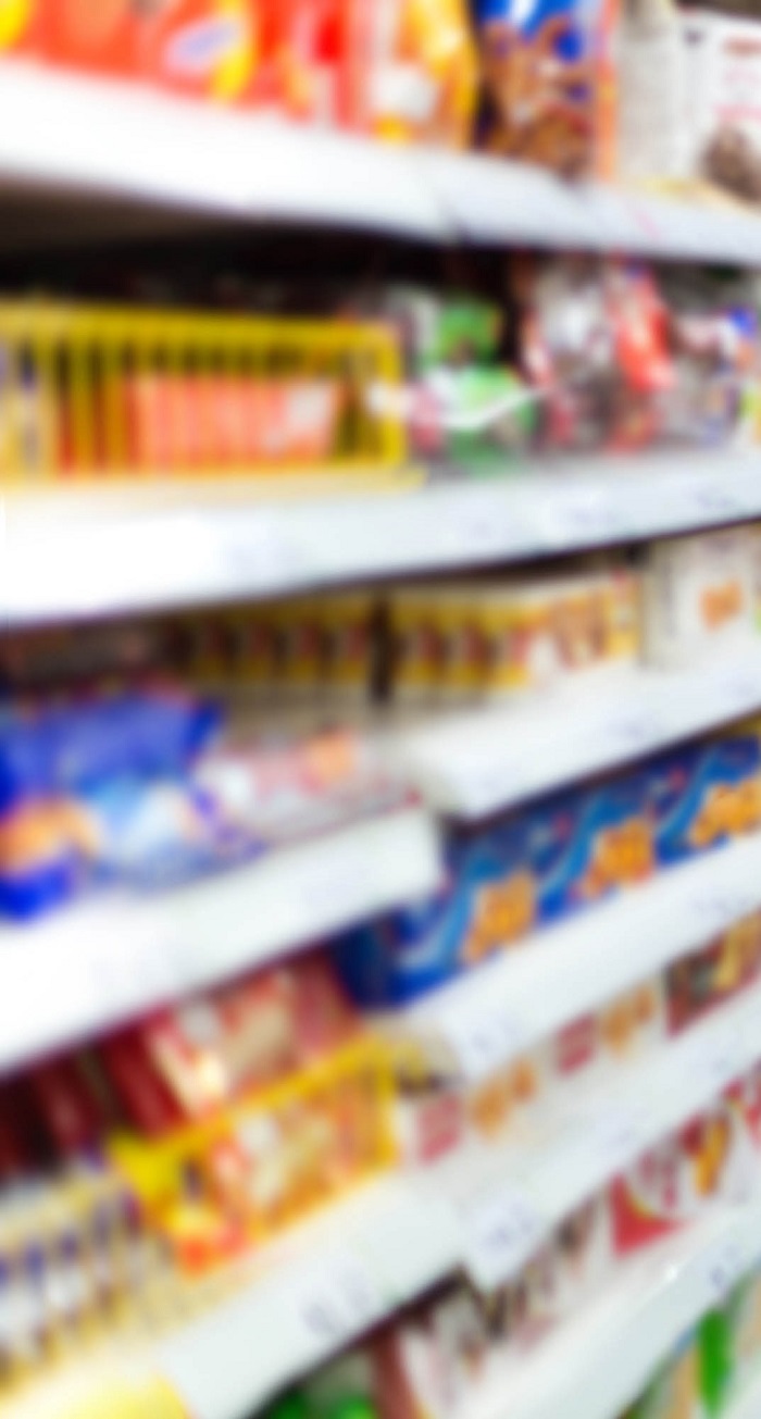 Woman checking food labelling